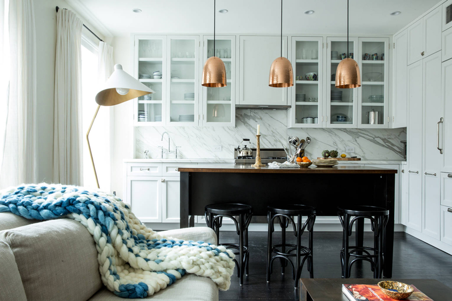 transitional kitchen with copper pendants