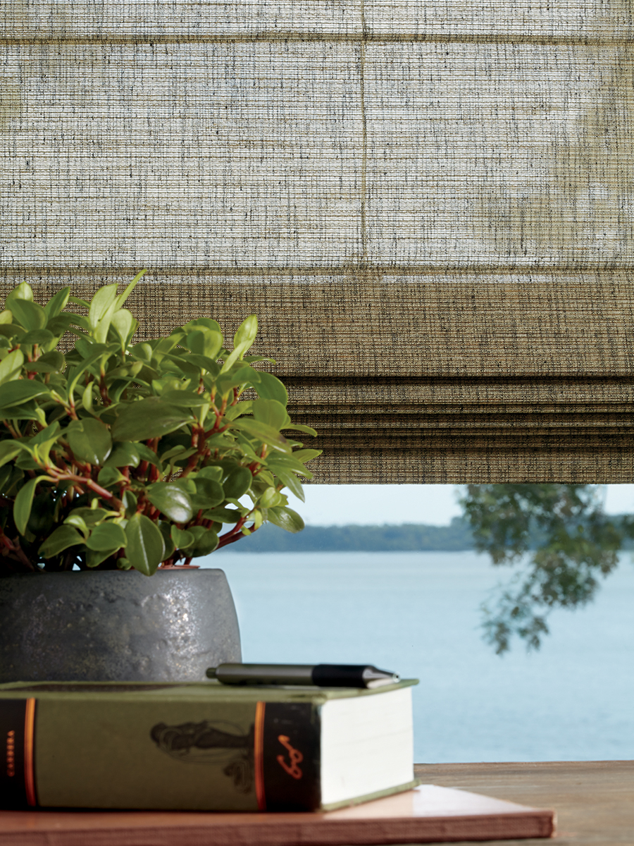 Alustra woven textured roman shades help bring our nature-inspired decor.