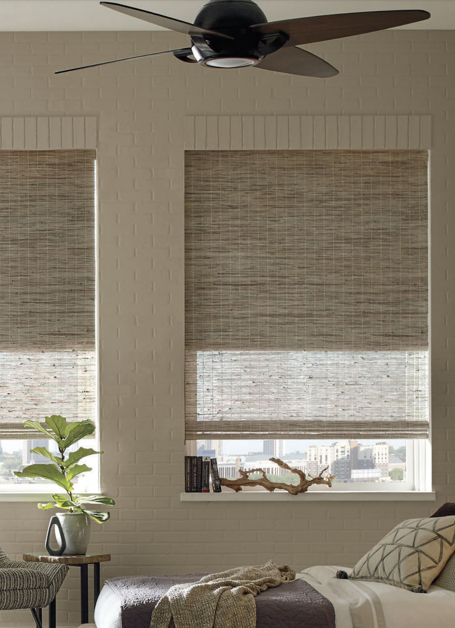 Bedroom with Provenance woven woods cellular dual shades by Hunter Douglas.