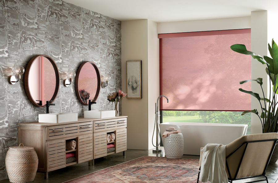 Designer Roller Shades in bathroom matching other accents of pink.