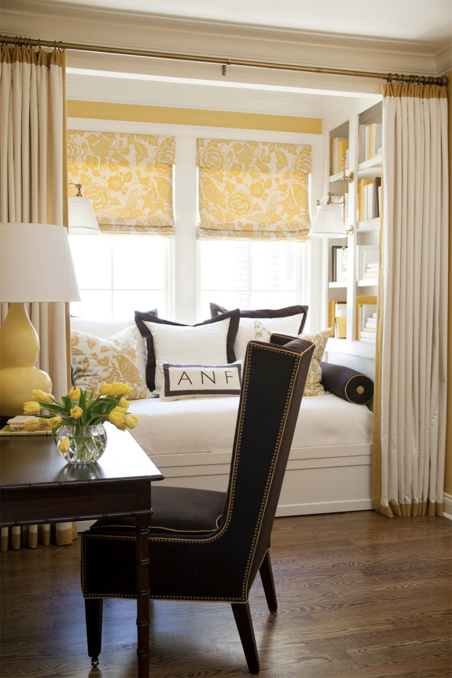 Bay window with yellow pops of color in breakfast nook.