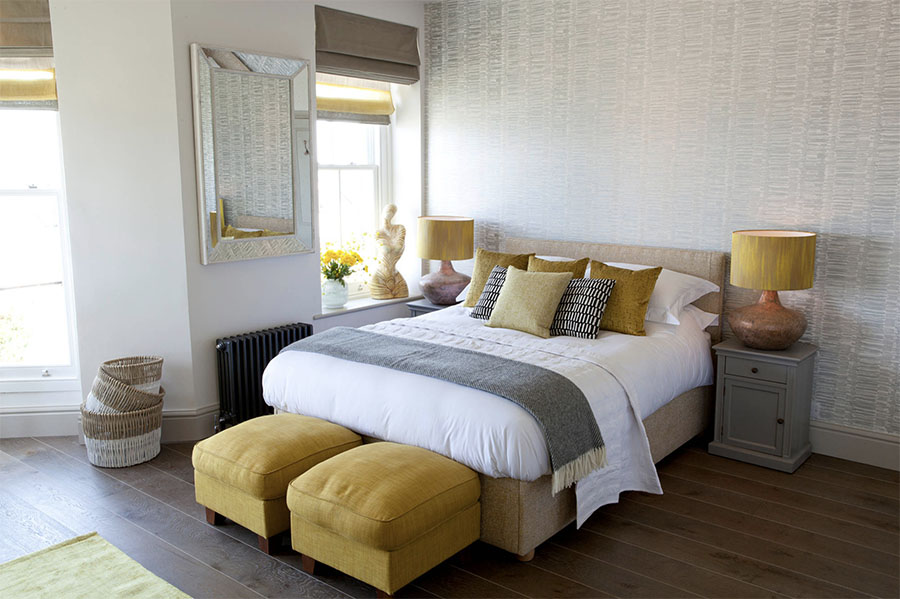 master bedroom with yellow and gray