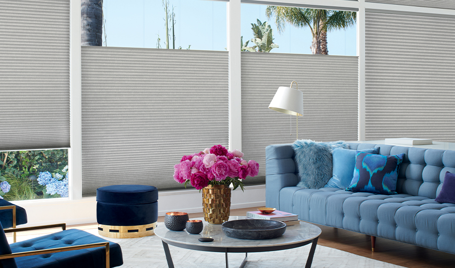 gray honeycomb shades with top down and gold decor