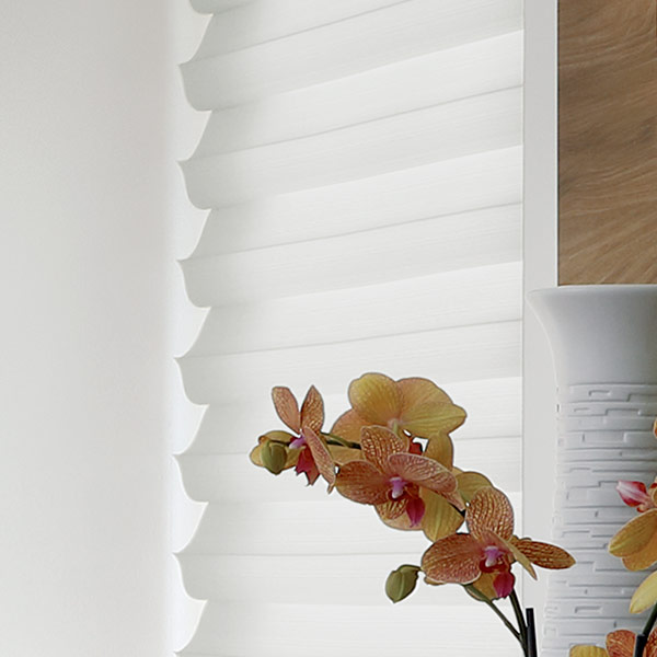 white home office with cellular roller shades