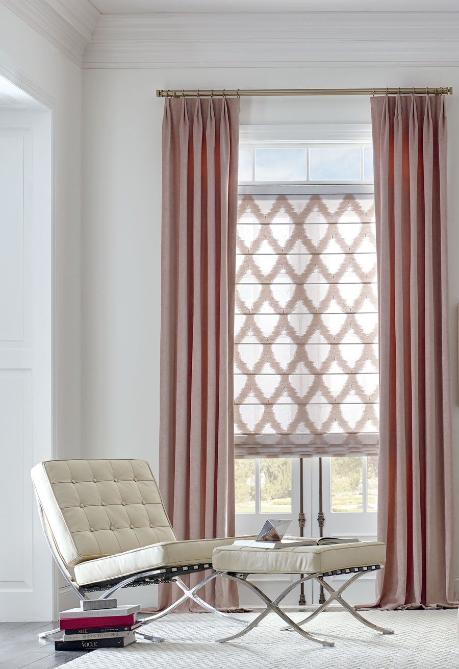 Patterned roman shades paired with matching draperies