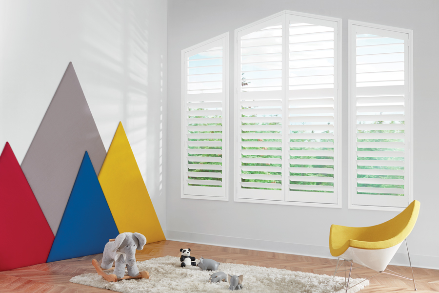 triangular window with hybrid shutters in kids playroom overland park, KS