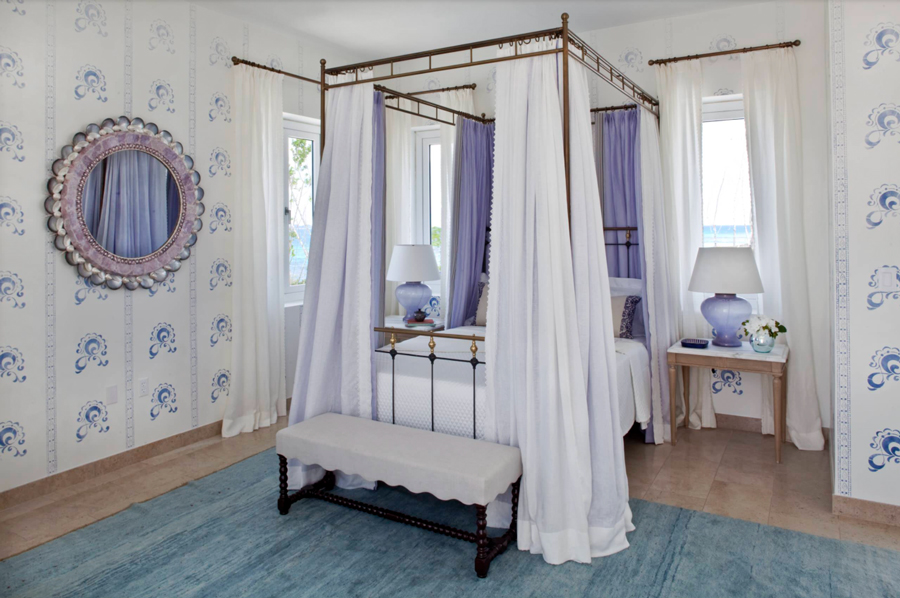 White bedroom with pops of periwinkle