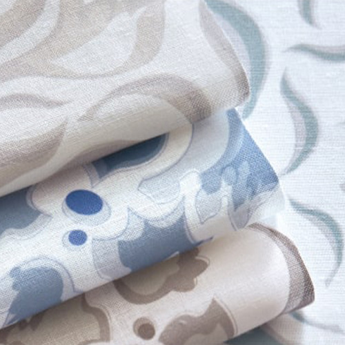 fabric options in beige and blue patterns for custom drapery