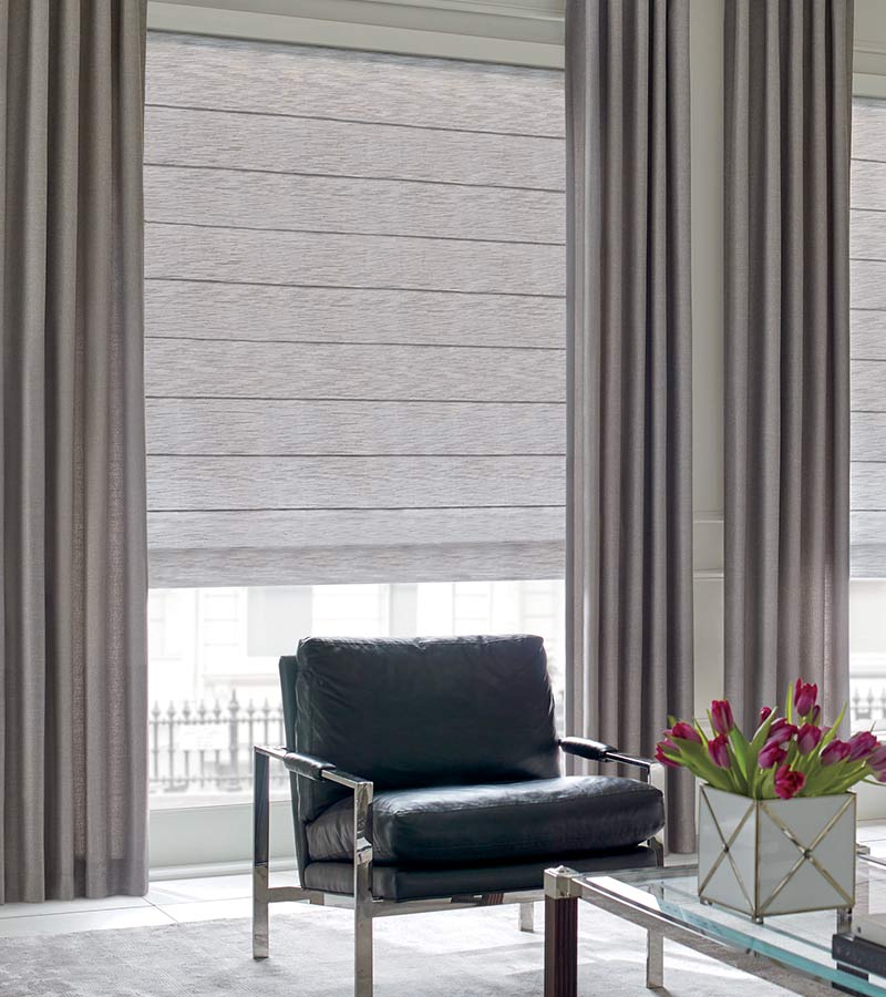 modern seating area with floor to ceiling drapery for large windows Shawnee, KS
