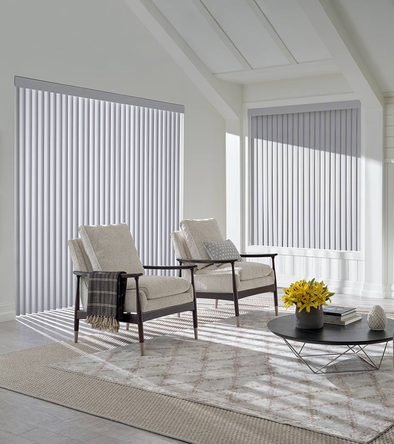 interior of living room space floor to ceiling window and modern armchairs in shawnee, KS