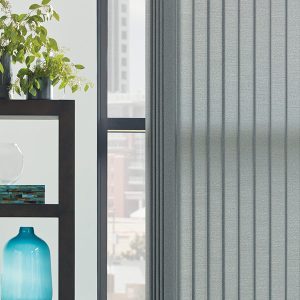 vertical-shades-blue-accents-grey-window-shades-one-stop-decorating grey vertical blinds in Shawnee KS apartment