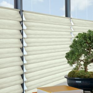 detail of fabric folds on roman shade and bonsai plant in Parkville MO